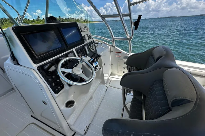  Yacht Photos Pics 2006 Hydra-Sports Vector 3300 VX boat cockpit with steering wheel and dual screens.