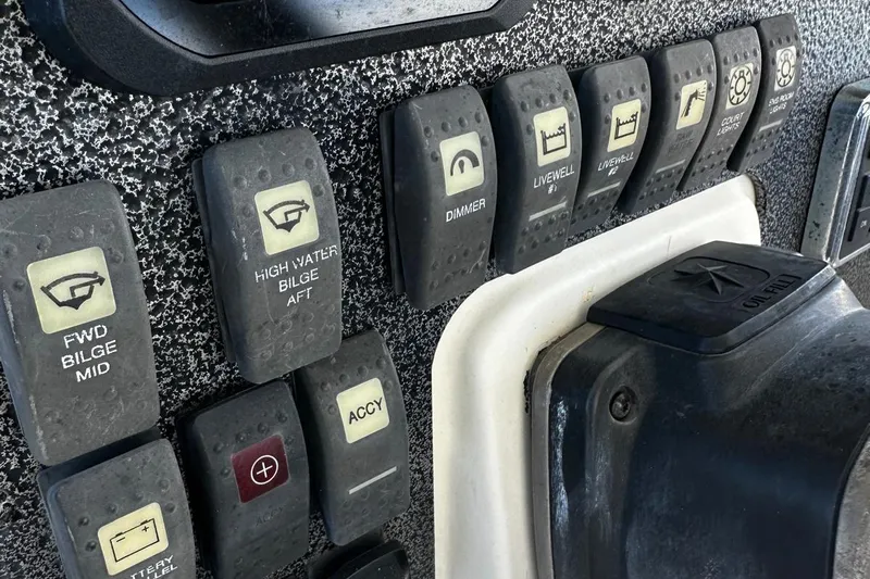  Yacht Photos Pics Control panel of a 2006 Hydra-Sports Vector 3300 VX boat with labeled switches.