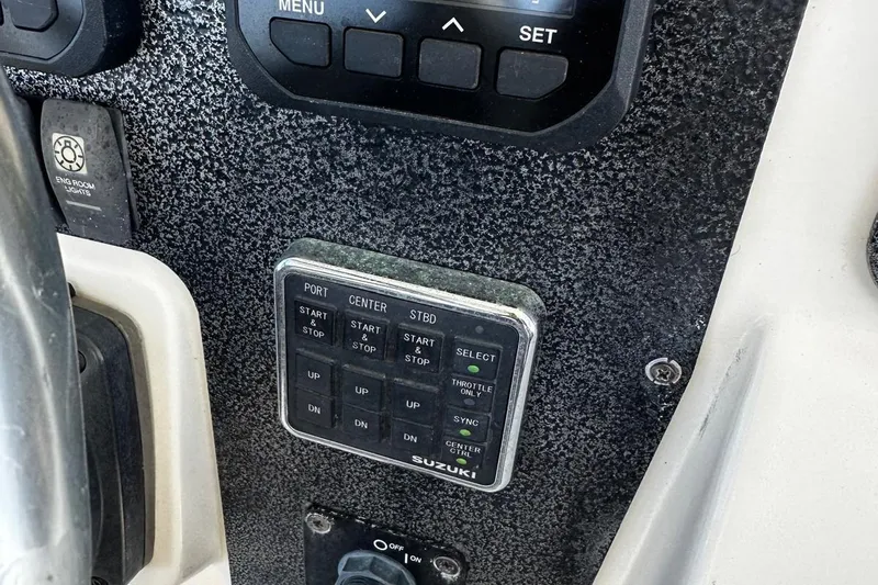  Yacht Photos Pics Control panel of a 2006 Hydra-Sports Vector 3300 VX boat with Suzuki engine controls.