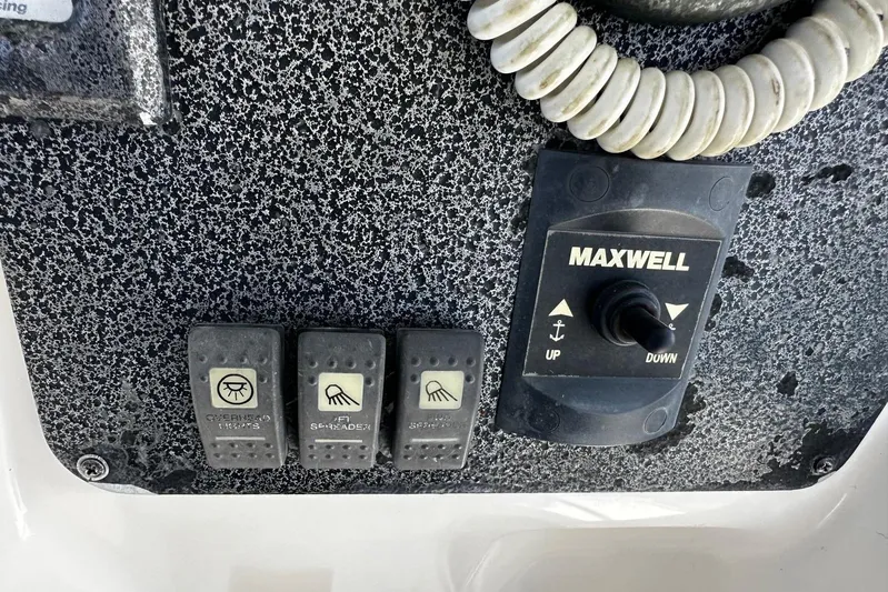  Yacht Photos Pics Control panel of a 2006 Hydra-Sports Vector 3300 VX boat with Maxwell switches.