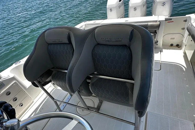  Yacht Photos Pics 2006 Hydra-Sports Vector 3300 VX boat seats with ocean backdrop and Suzuki engines.