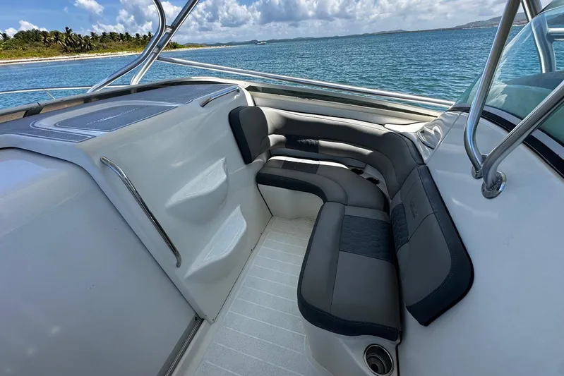  Yacht Photos Pics 2006 Hydra-Sports Vector 3300 VX boat interior with cushioned seating, ocean view.