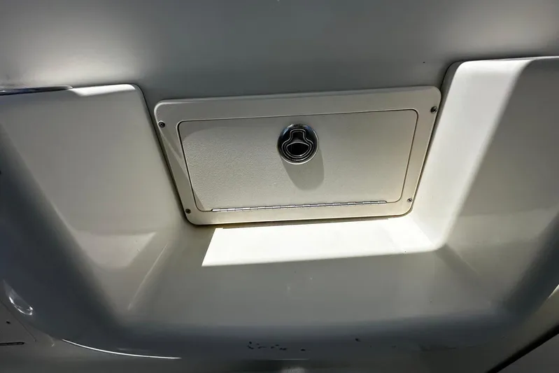  Yacht Photos Pics 2006 Hydra-Sports Vector 3300 VX boat compartment with latch, white interior.
