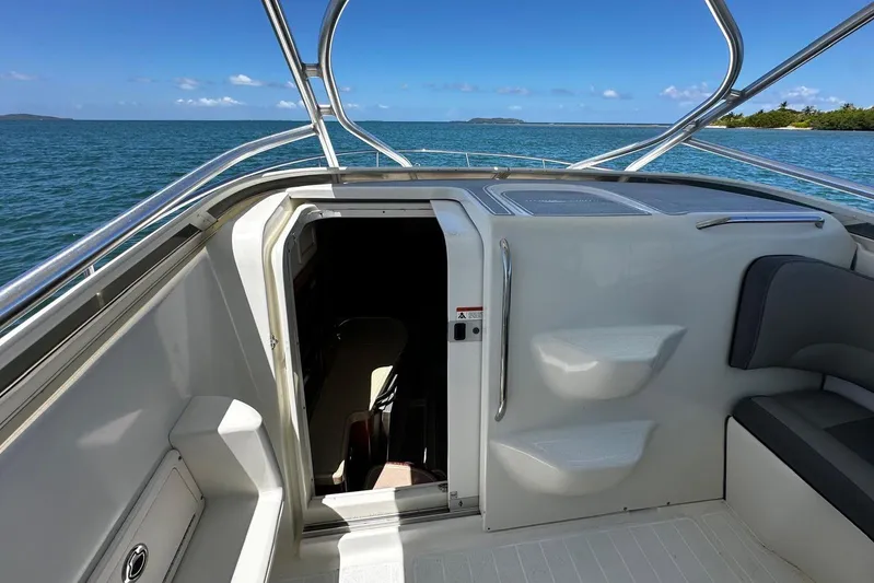  Yacht Photos Pics 2006 Hydra-Sports Vector 3300 VX boat interior with open cabin door, ocean view.