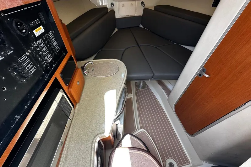  Yacht Photos Pics 2006 Hydra-Sports Vector 3300 VX cabin interior with kitchenette and seating area.