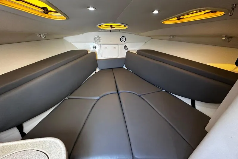  Yacht Photos Pics 2006 Hydra-Sports Vector 3300 VX cabin interior with sleek black seating.