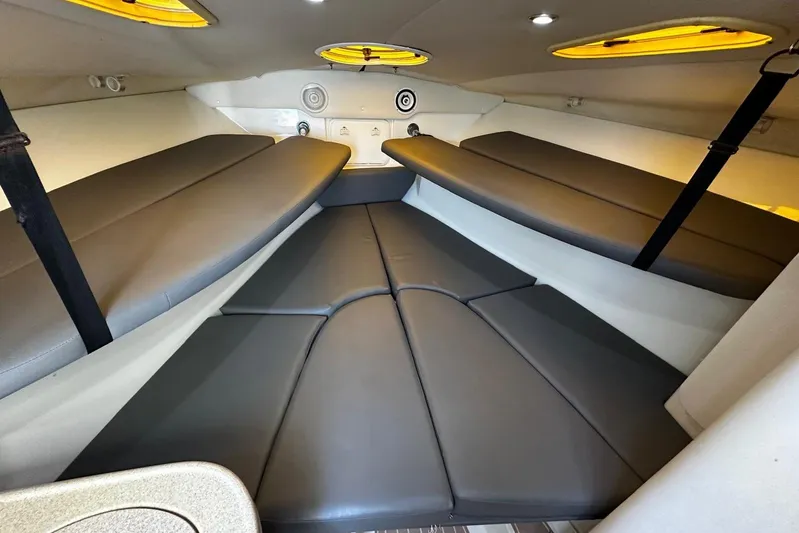  Yacht Photos Pics 2006 Hydra-Sports Vector 3300 VX cabin interior with cushioned seating and ambient lighting.