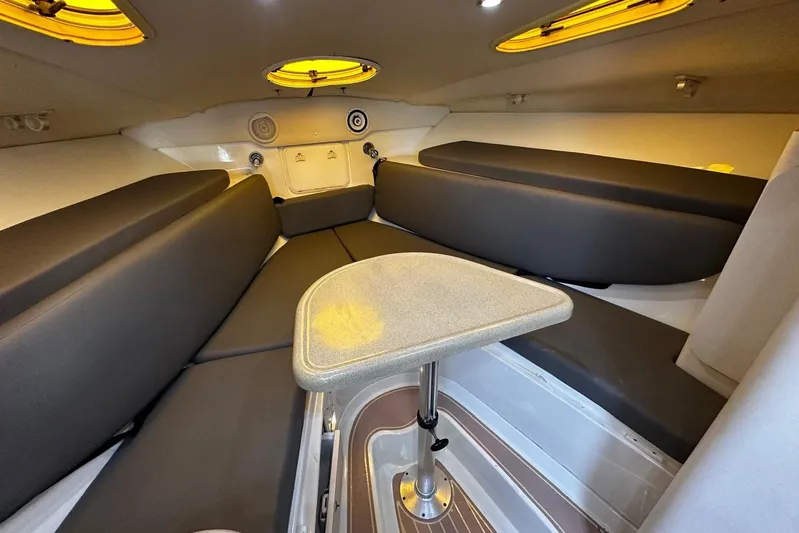  Yacht Photos Pics 2006 Hydra-Sports Vector 3300 VX cabin interior with seating and table.