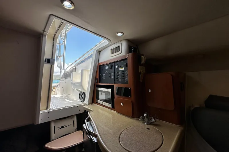  Yacht Photos Pics 2006 Hydra-Sports Vector 3300 VX cabin interior with control panel and sink.