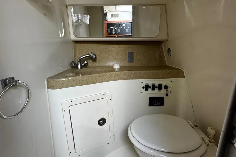  Yacht Photos Pics 2006 Hydra-Sports Vector 3300 VX boat bathroom with sink, mirror, and toilet.