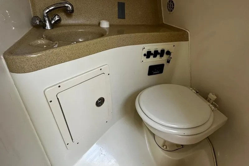  Yacht Photos Pics 2006 Hydra-Sports Vector 3300 VX boat bathroom with sink and toilet.