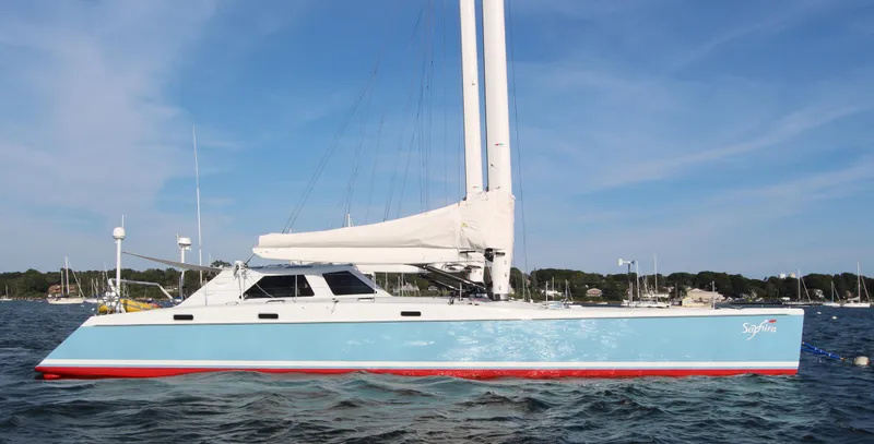 Saphira Yacht Photos Pics Sailing yacht "SAPHIRA," Chris White Atlantic 70, 2018, on calm waters.