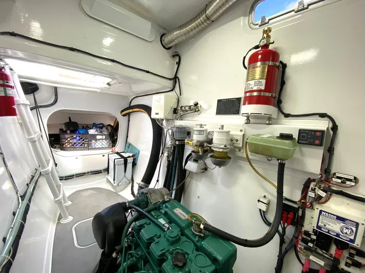 Saphira Yacht Photos Pics Engine room of 2018 Chris White Atlantic 70 "SAPHIRA" with visible equipment and fire extinguisher.