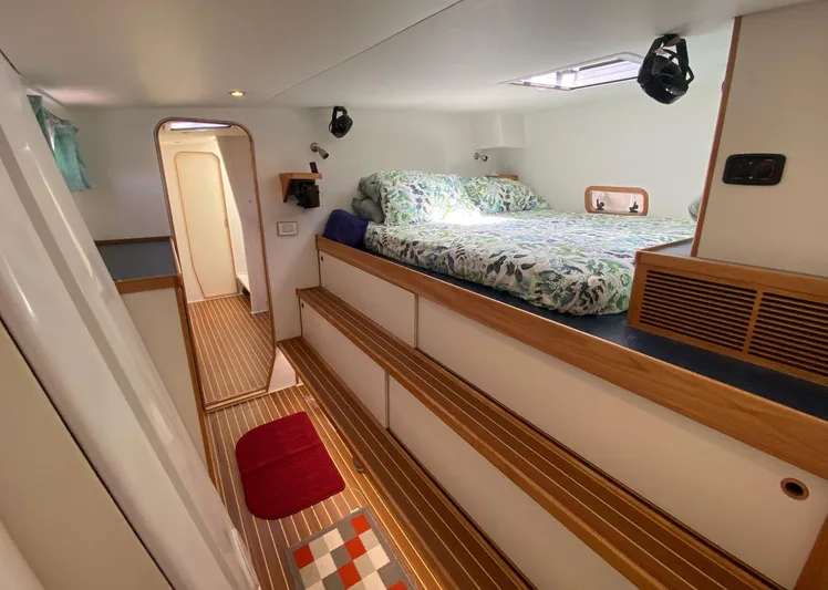 Saphira Yacht Photos Pics Luxurious cabin interior of 2018 Chris White Atlantic 70 "SAPHIRA" with cozy bed and wooden flooring.