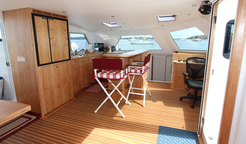 Saphira Yacht Photos Pics Luxurious interior of 2018 Chris White Atlantic 70 "SAPHIRA" yacht with wooden flooring and seating.