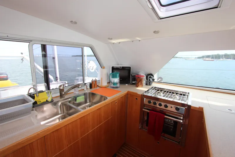 Saphira Yacht Photos Pics Modern kitchen interior on Chris White Atlantic 70 "SAPHIRA" yacht, featuring ocean view.