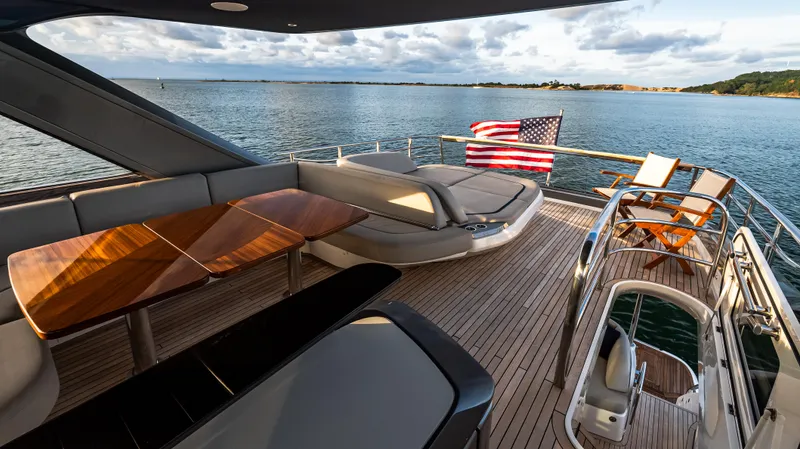 Stella Maris Yacht Photos Pics Luxurious 2022 Princess Y72 Motor Yacht deck with elegant seating and ocean view.