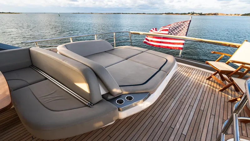 Stella Maris Yacht Photos Pics Luxurious 2022 Princess Y72 Motor Yacht deck with seating and American flag.