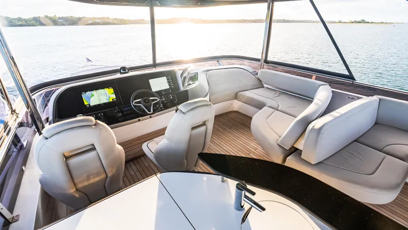 Stella Maris Yacht Photos Pics Luxurious interior of 2022 Princess Y72 Motor Yacht with plush seating and modern controls.