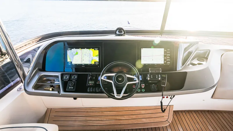 Stella Maris Yacht Photos Pics 2022 Princess Y72 Motor Yacht helm with navigation screens and steering wheel.