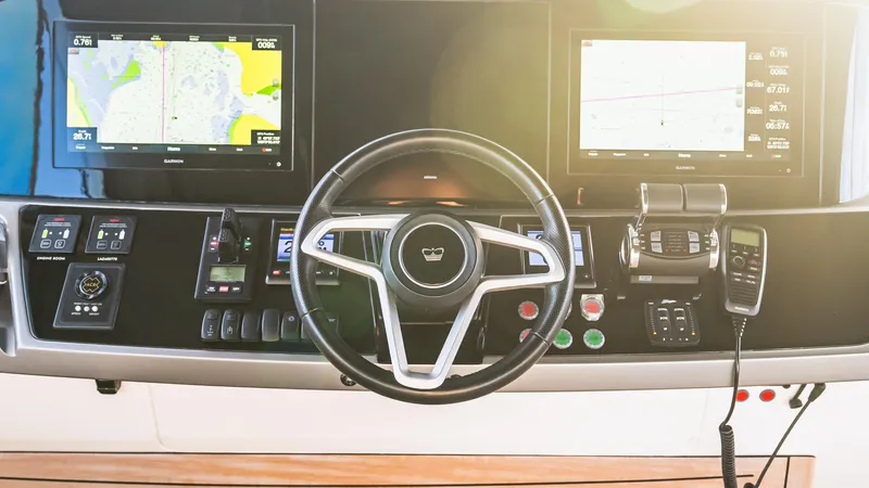 Stella Maris Yacht Photos Pics Steering console of 2022 Princess Y72 Motor Yacht with navigation screens and controls.