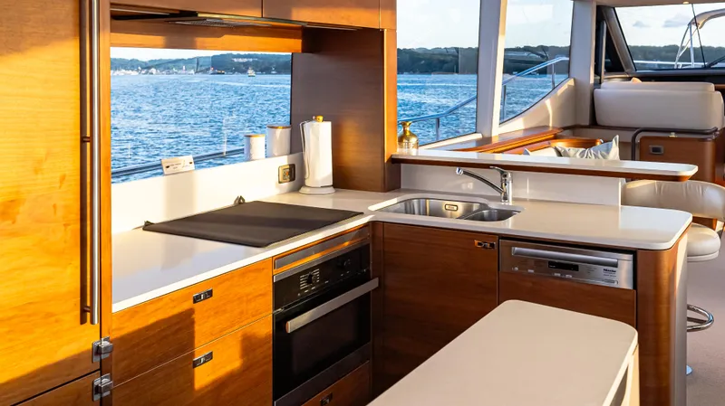 Stella Maris Yacht Photos Pics Luxurious kitchen interior of 2022 Princess Y72 Motor Yacht with ocean view.