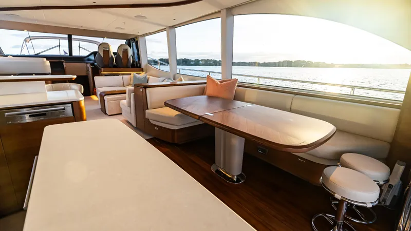 Stella Maris Yacht Photos Pics Luxurious interior of 2022 Princess Y72 Motor Yacht with elegant seating and dining area.