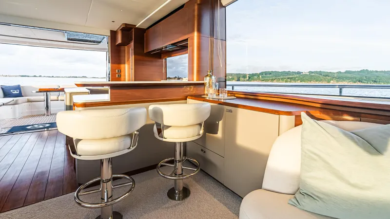 Stella Maris Yacht Photos Pics Luxurious interior of 2022 Princess Y72 Motor Yacht with elegant seating and scenic views.