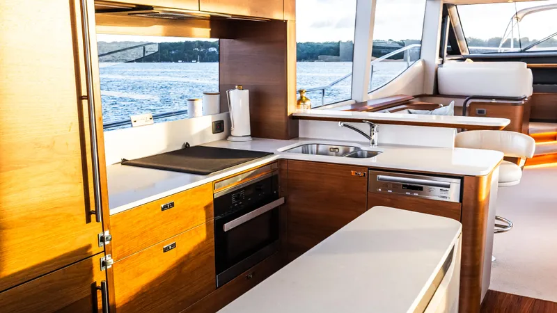 Stella Maris Yacht Photos Pics Luxurious kitchen interior of 2022 Princess Y72 Motor Yacht with modern amenities and scenic view.