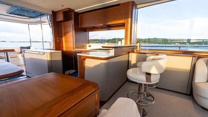 Stella Maris Yacht Photos Pics Luxurious interior of 2022 Princess Y72 Motor Yacht with elegant wood finishes and scenic views.