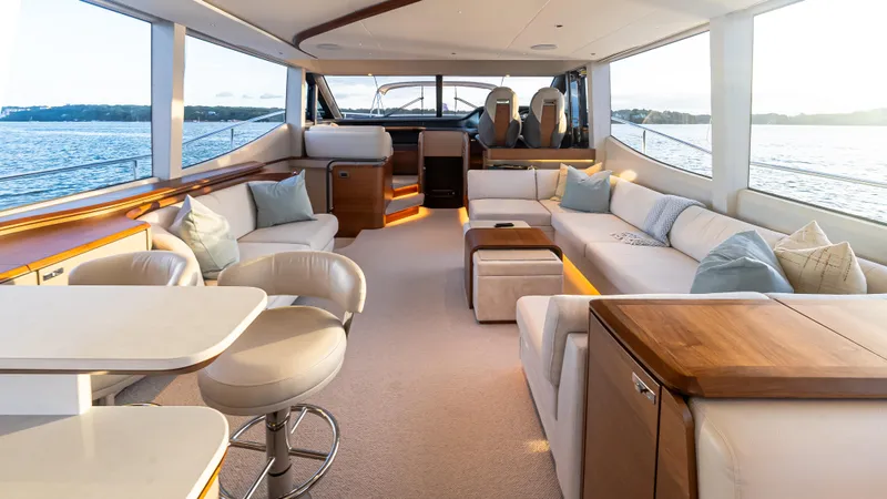 Stella Maris Yacht Photos Pics Luxurious interior of 2022 Princess Y72 Motor Yacht with elegant seating and panoramic windows.