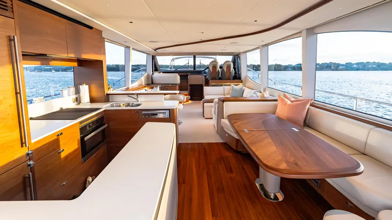 Stella Maris Yacht Photos Pics Luxurious interior of 2022 Princess Y72 Motor Yacht with elegant wood finishes and spacious seating.