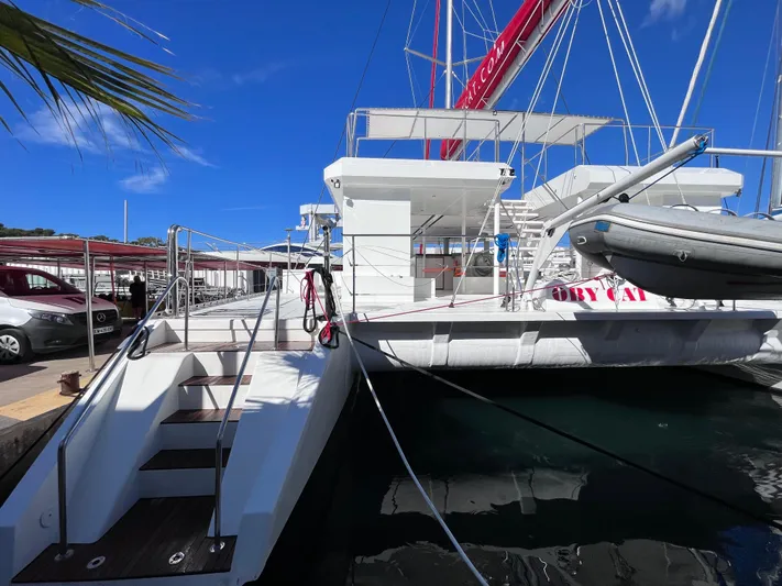  Yacht Photos Pics 2025 Catana Taino 21 Day Charter catamaran docked under clear blue sky.
