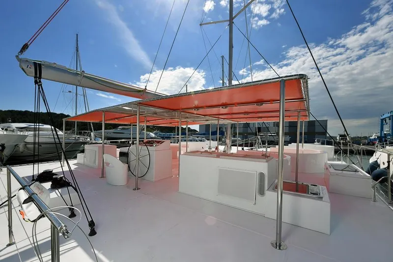  Yacht Photos Pics Catana Taino 21 Day Charter 2025 yacht with spacious deck and orange canopy.
