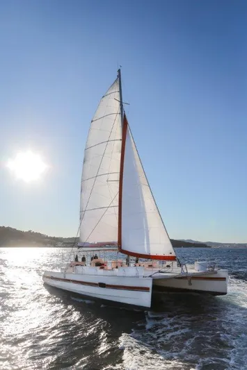  Yacht Photos Pics Sailing Catana Taino 21 Day Charter 2025 on sunny ocean waters.