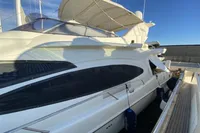 2007 Azimut 68E yacht docked, showcasing sleek design and luxurious features.