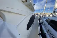 2007 Azimut 68E yacht docked in a marina, showcasing sleek design and luxury features.
