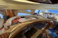 Luxurious interior of a 2007 Azimut 68E yacht with elegant seating and modern amenities.