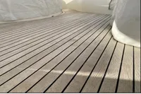 Teak deck of a 2007 Azimut 68E yacht, showcasing elegant wood grain.