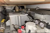 Engine room of a 2007 Azimut 68E yacht, showcasing mechanical components and gauges.