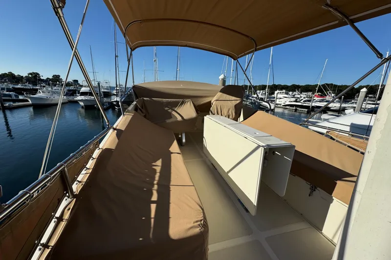  Yacht Photos Pics 2000 Pacific Seacraft 38T Fast Trawler docked at marina, covered seating area.
