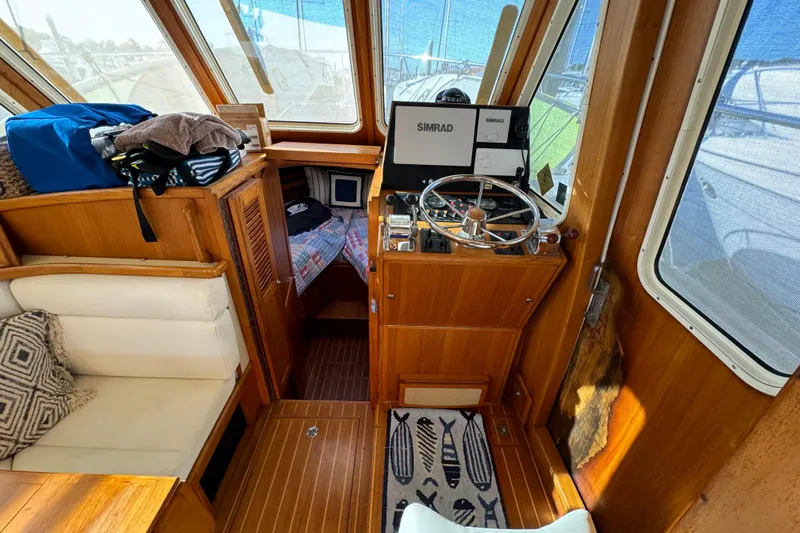  Yacht Photos Pics Interior of 2000 Pacific Seacraft 38T Fast Trawler with helm and seating area.