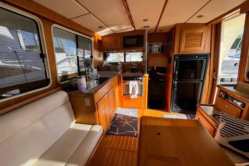  Yacht Photos Pics Interior of 2000 Pacific Seacraft 38T Fast Trawler with wood finish and modern amenities.