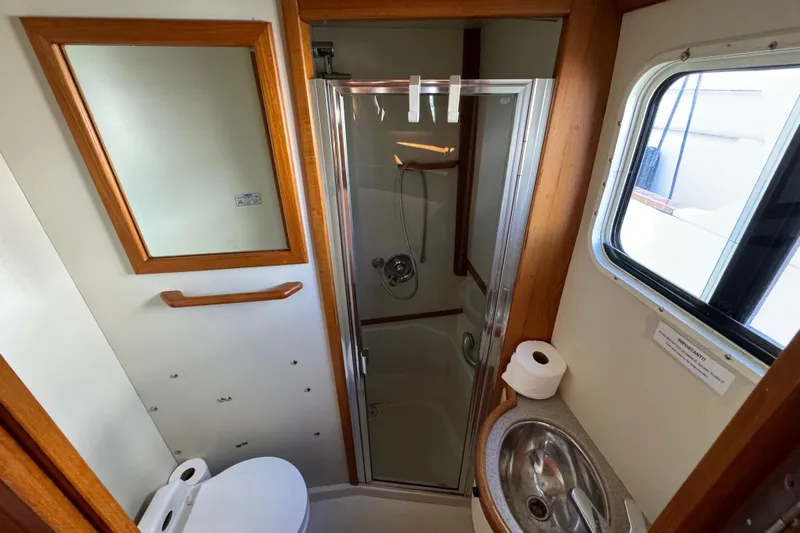  Yacht Photos Pics Bathroom interior of 2000 Pacific Seacraft 38T Fast Trawler with shower and sink.