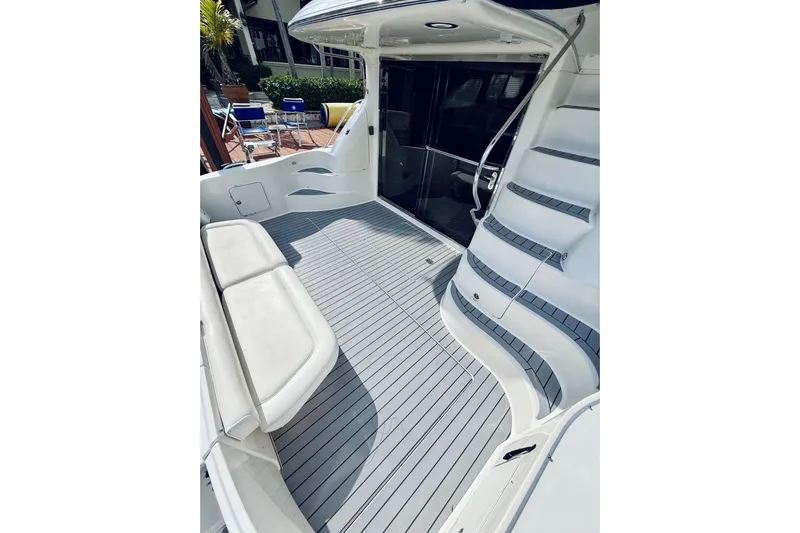 Rogue One Yacht Photos Pics 2003 Sea Ray 560 Sedan Bridge yacht deck with seating and stairs.