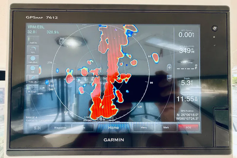 Rogue One Yacht Photos Pics Garmin GPSMAP 7612 display on 2003 Sea Ray 560 Sedan Bridge, showing radar and navigation data.