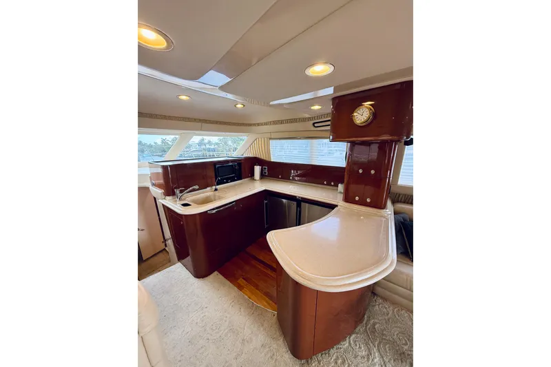 Rogue One Yacht Photos Pics Luxurious 2003 Sea Ray 560 Sedan Bridge yacht interior with modern kitchen amenities.