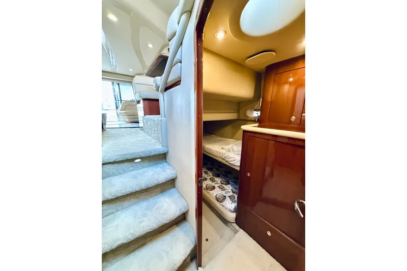 Rogue One Yacht Photos Pics 2003 Sea Ray 560 Sedan Bridge interior with stairs and cozy cabin.