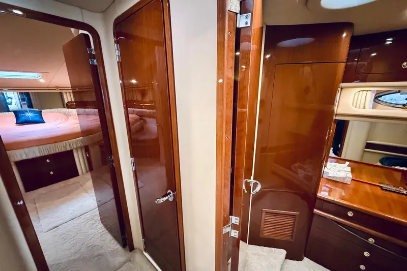 Rogue One Yacht Photos Pics Luxurious interior of 2003 Sea Ray 560 Sedan Bridge yacht with wood finishes.