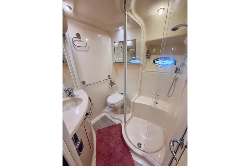 Rogue One Yacht Photos Pics Luxurious bathroom in 2003 Sea Ray 560 Sedan Bridge yacht with shower and vanity.